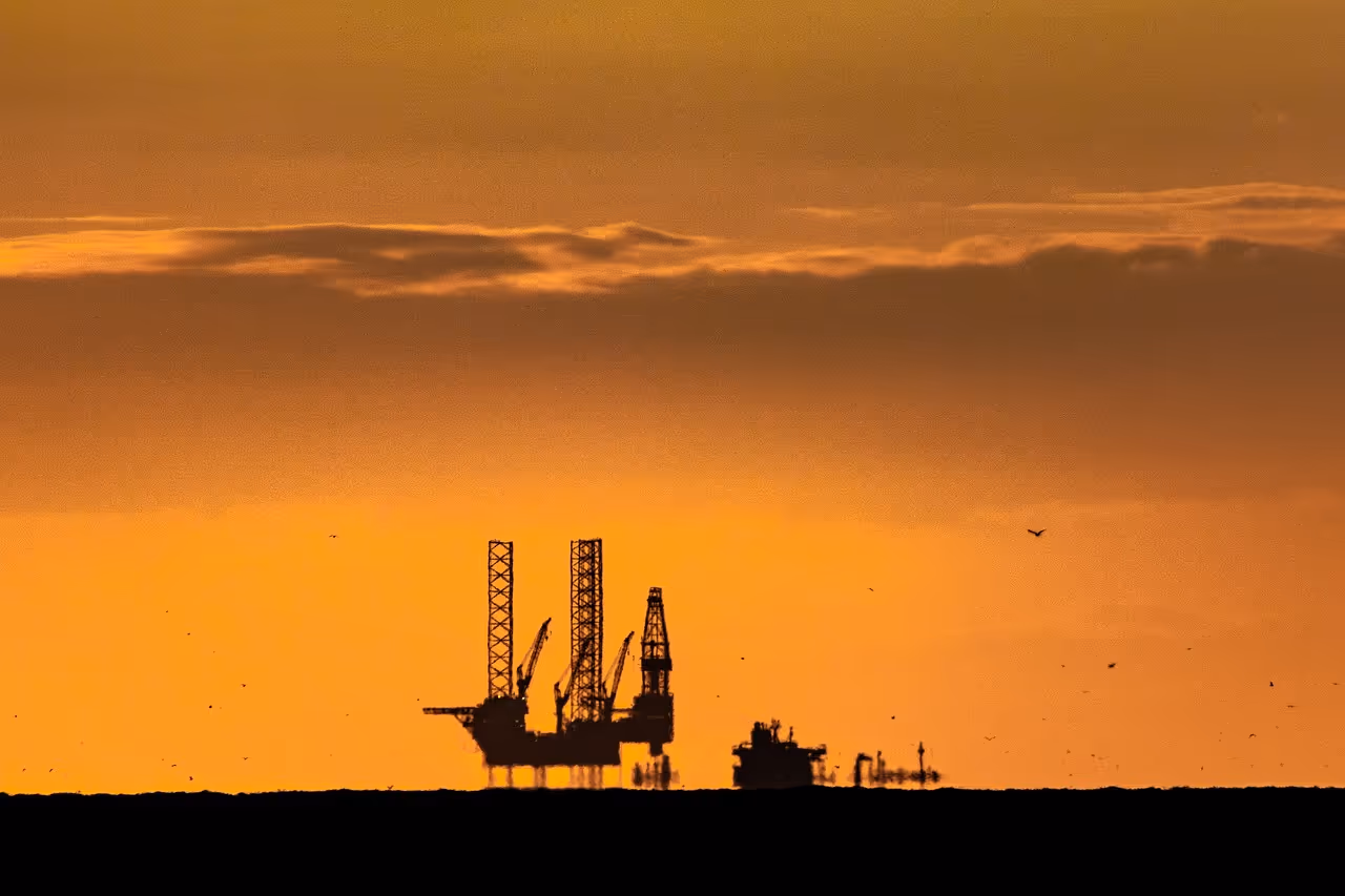 Offshore oil drilling platform at sunset representing oil and gas industry bolting applications