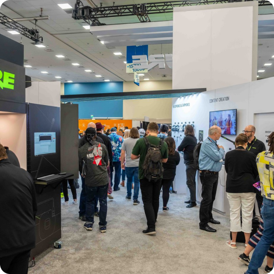 A large gathering of people in a conference lobby