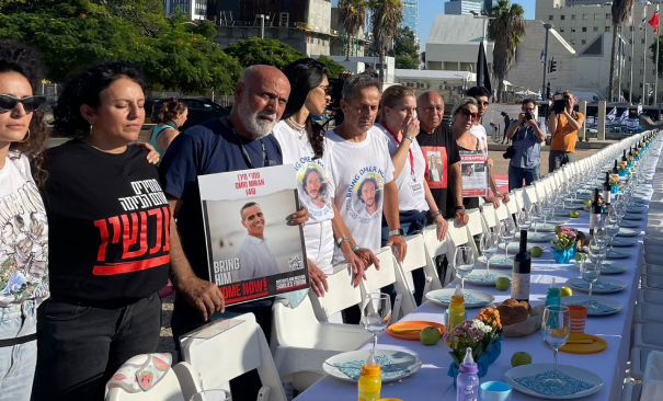 Hostages' families standing around a holiday table