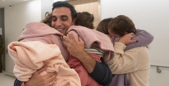 Yoni Asher reunites with his wife and daughters after they were freed from captivity