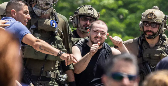 Almog Meir Jan arriving in Israel escorted by IDF soldiers, after the rescue operation