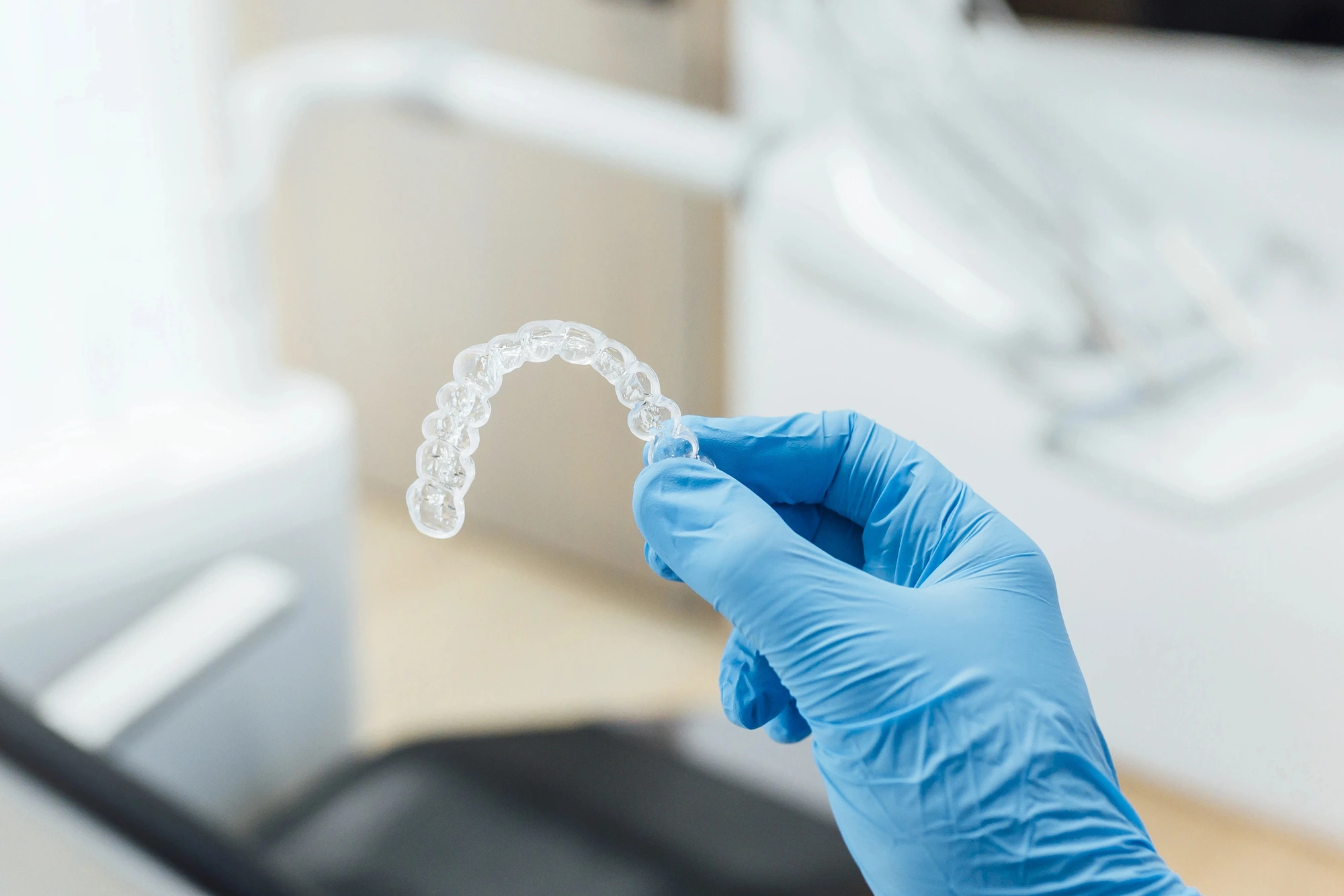 dentist holding Invisalign in Houston