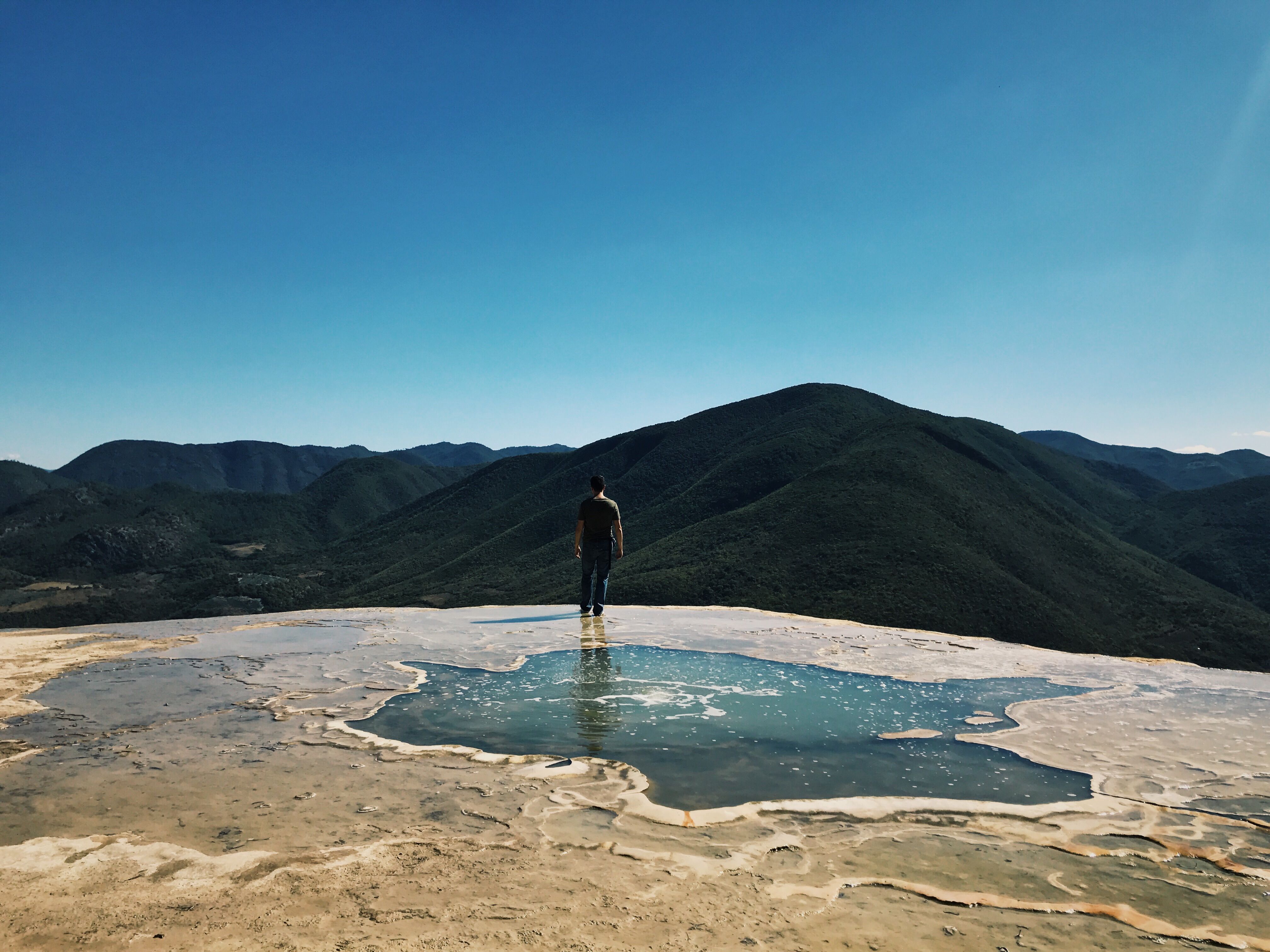 A complete 2026 Hierve el Agua tour guide traveler viewing mountains