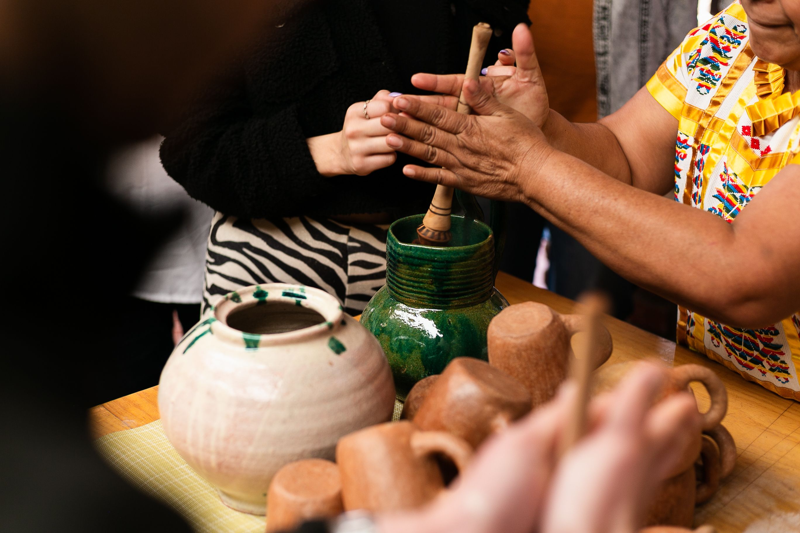 Oaxaca artisan guide green glazed ceramics demonstration
