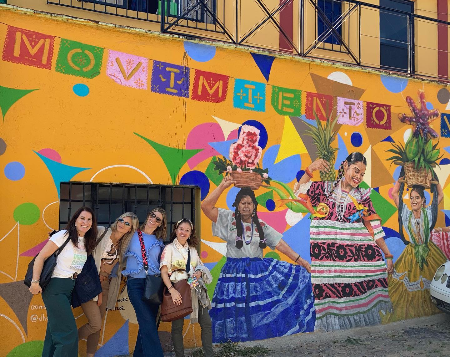 Are Puerto Escondido to Oaxaca Day Trip Tours Worth It – Travelers at a mural in Barrio Xochimilco, Oaxaca.