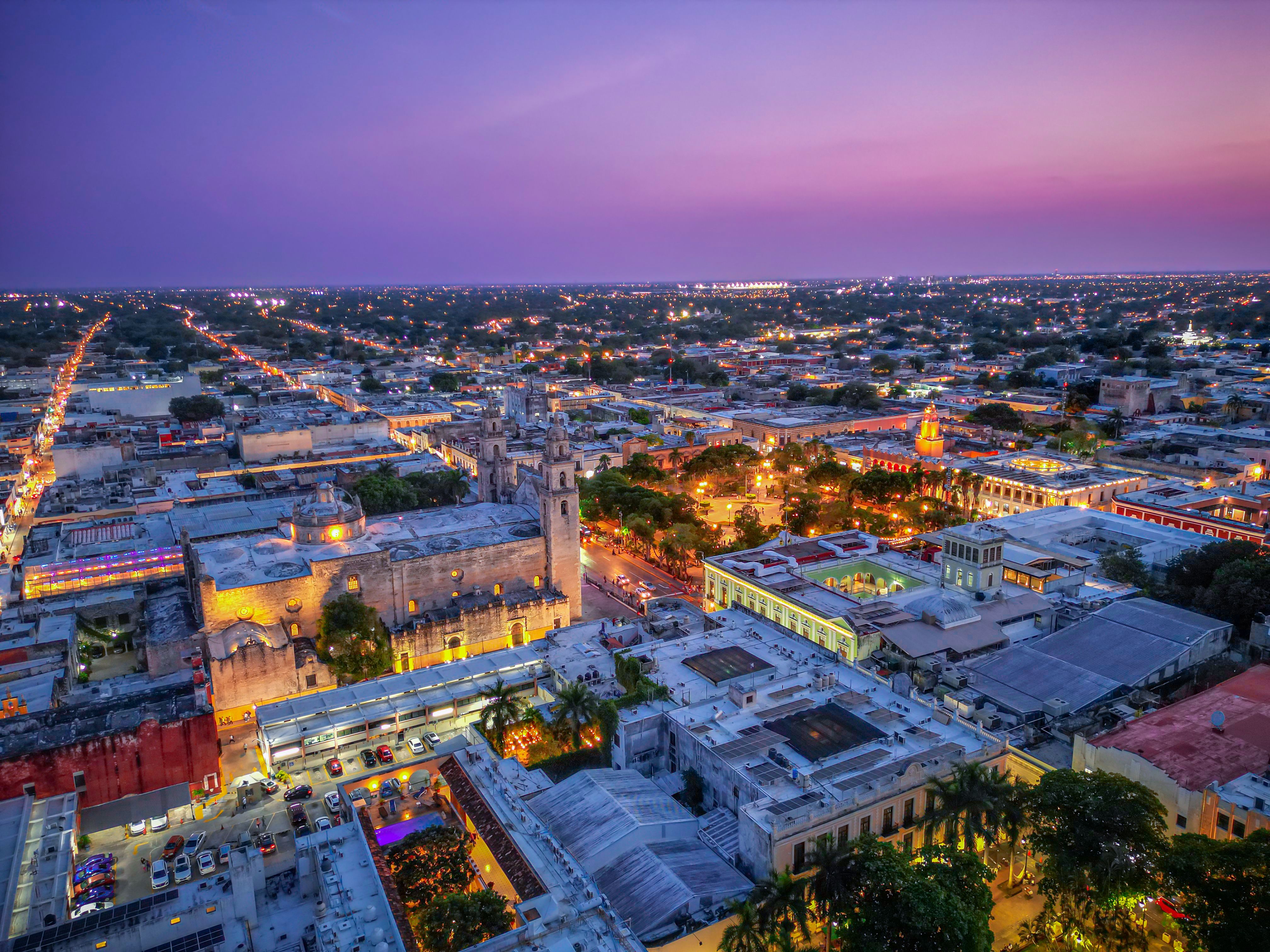 Your Complete Guide to Mérida Tours in 2026 – Aerial view of Mérida city center at sunset.