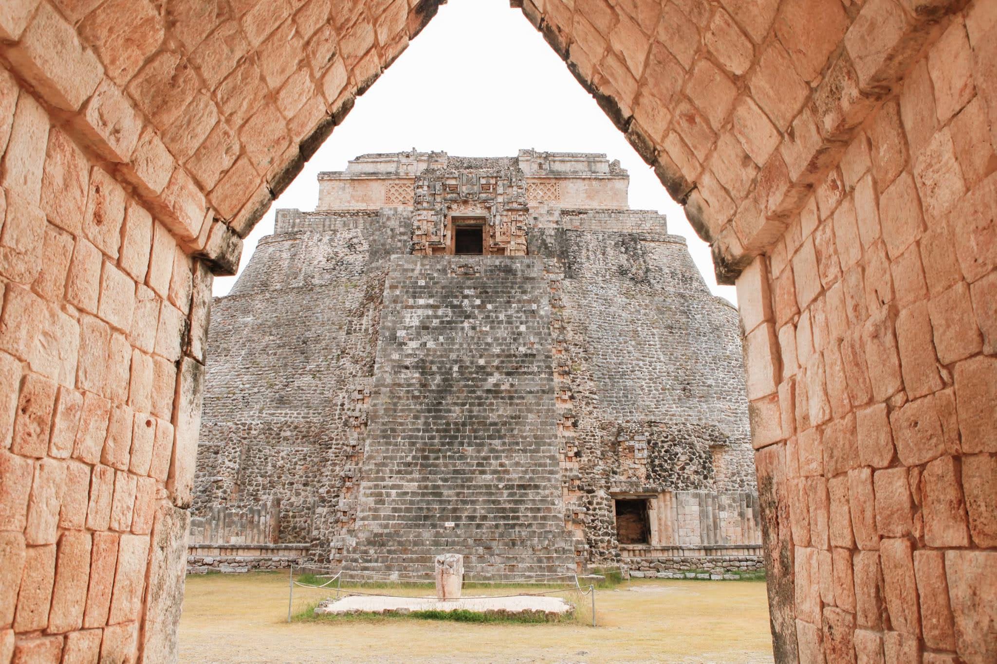 A Complete 2026 Uxmal Tour Guide – Framed view of the Pyramid of the Magician at Uxmal, Yucatán.