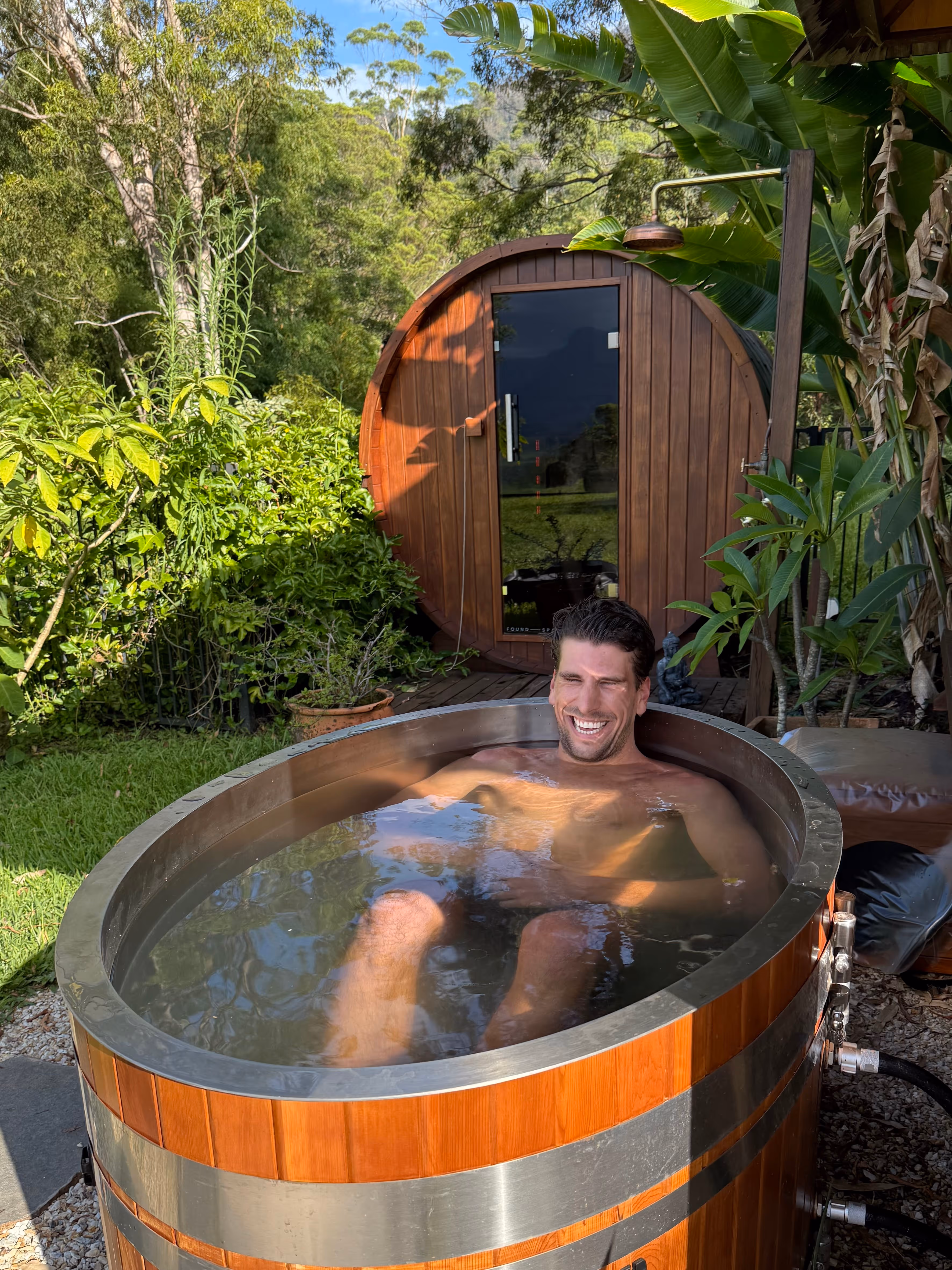 Woman next to Buddha statue during a juice detox in Australia