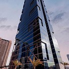 a tall building with glass windows