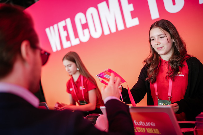 After having their QR passes scanned, attendees immediately collect personalized event badges (photo courtesy of IMPACT)