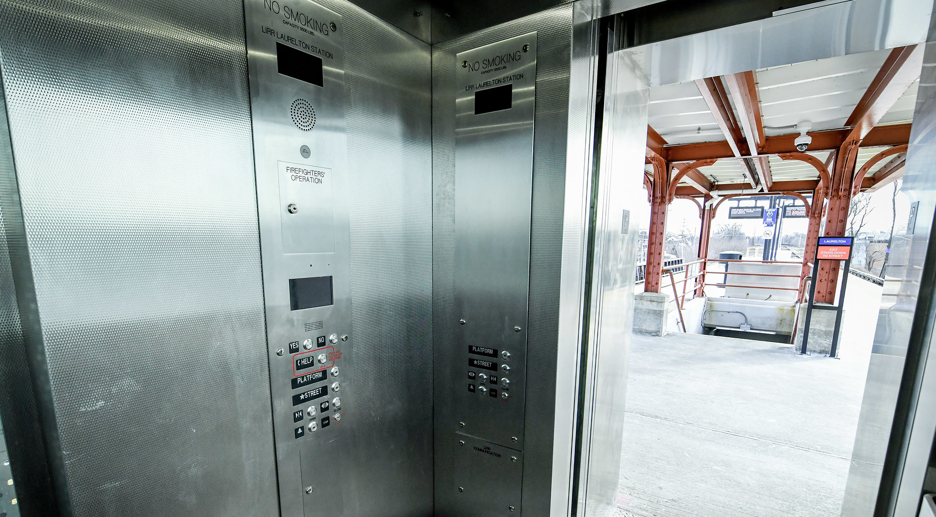 Completed elevator installation at LIRR Laurelton Station showing the car operating panel and help button
