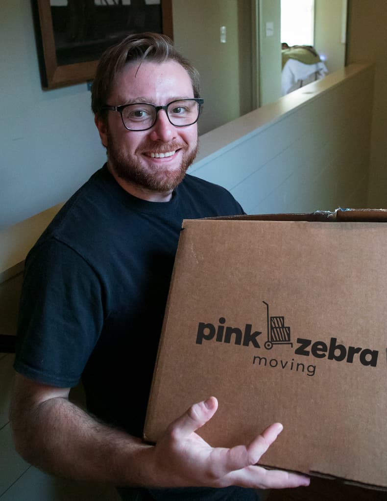 Pink Zebra mover carrying a box
