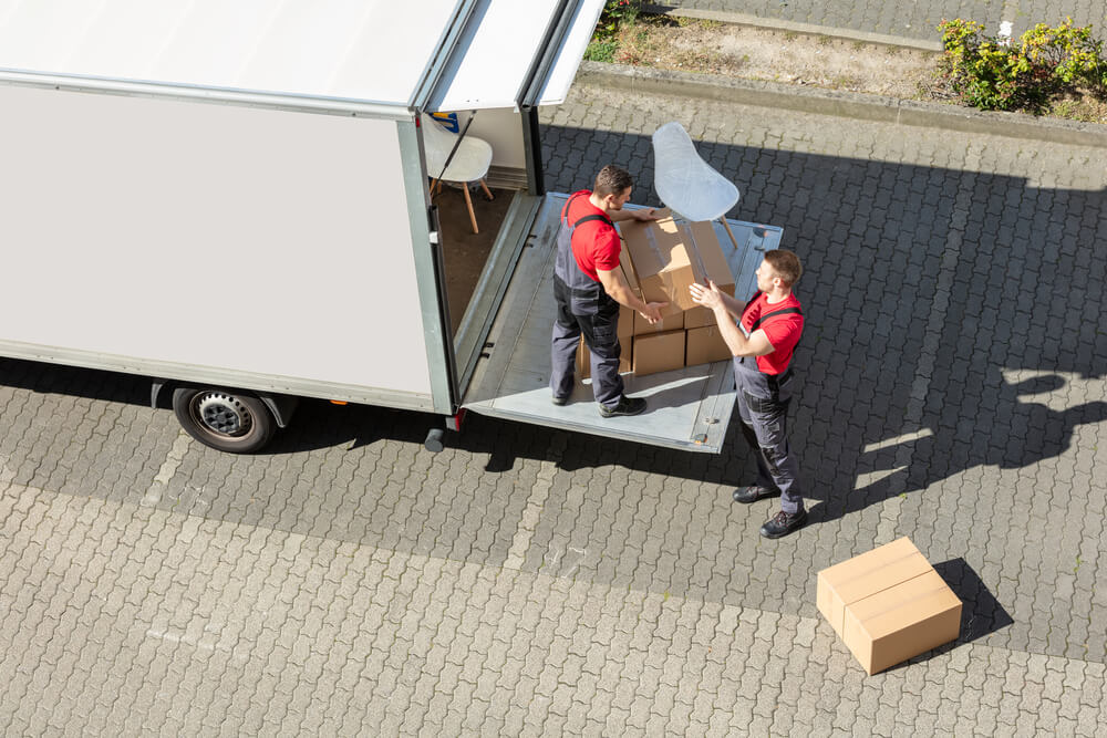 Movers in Columbus loading boxes into a moving truck