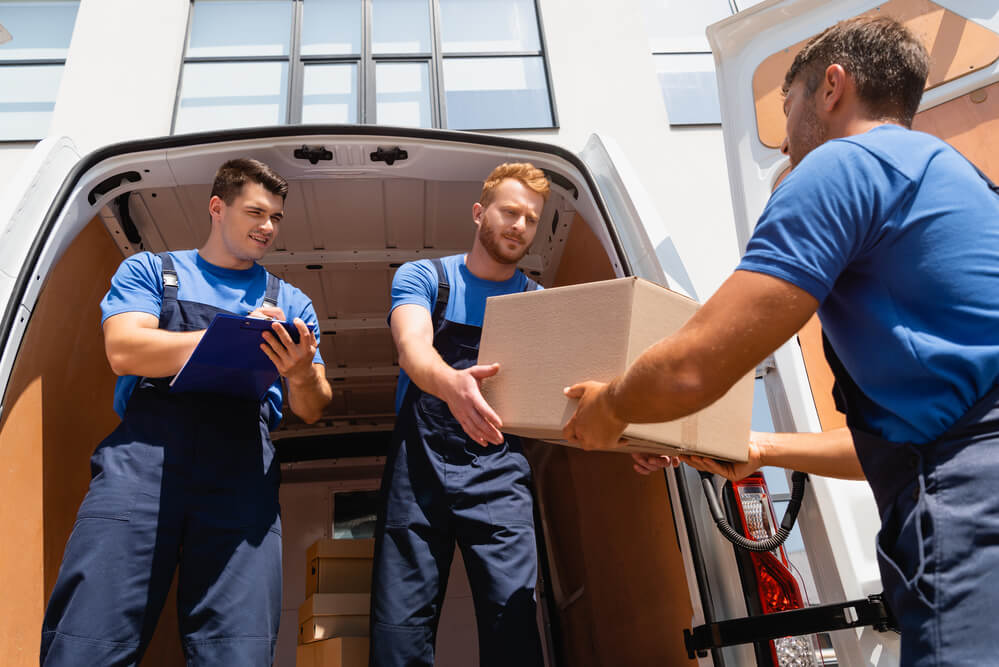 Putting boxes inside the moving truck with auburn movers