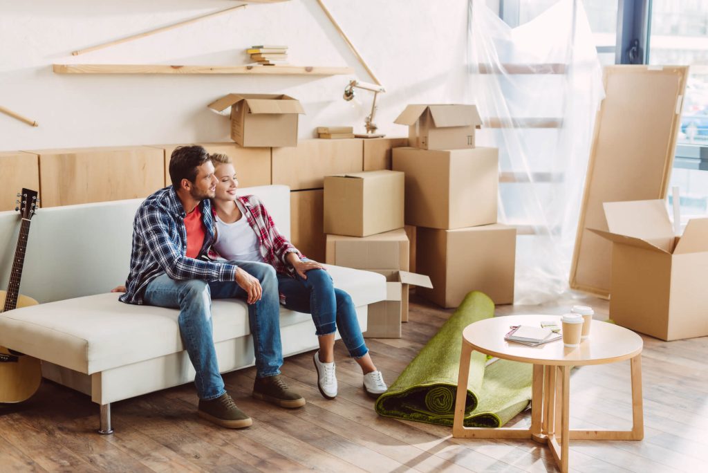 a happy couple after using an Apartment Moving Company