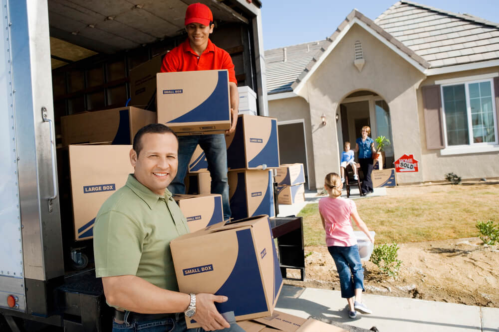 Movers in Nashville helping a family unload.
