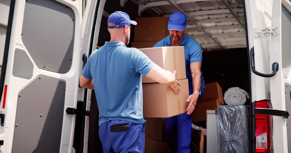Movers in Montgomery unloading boxes.