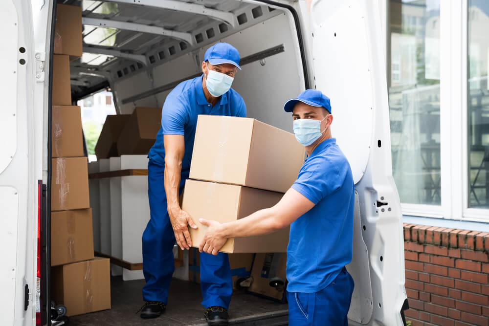 Movers in Auburn AL unloading some boxes.