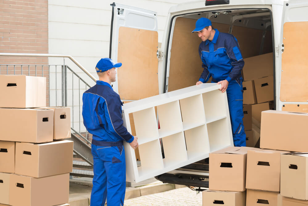 Athens Moving Experts unloading a shelf.
