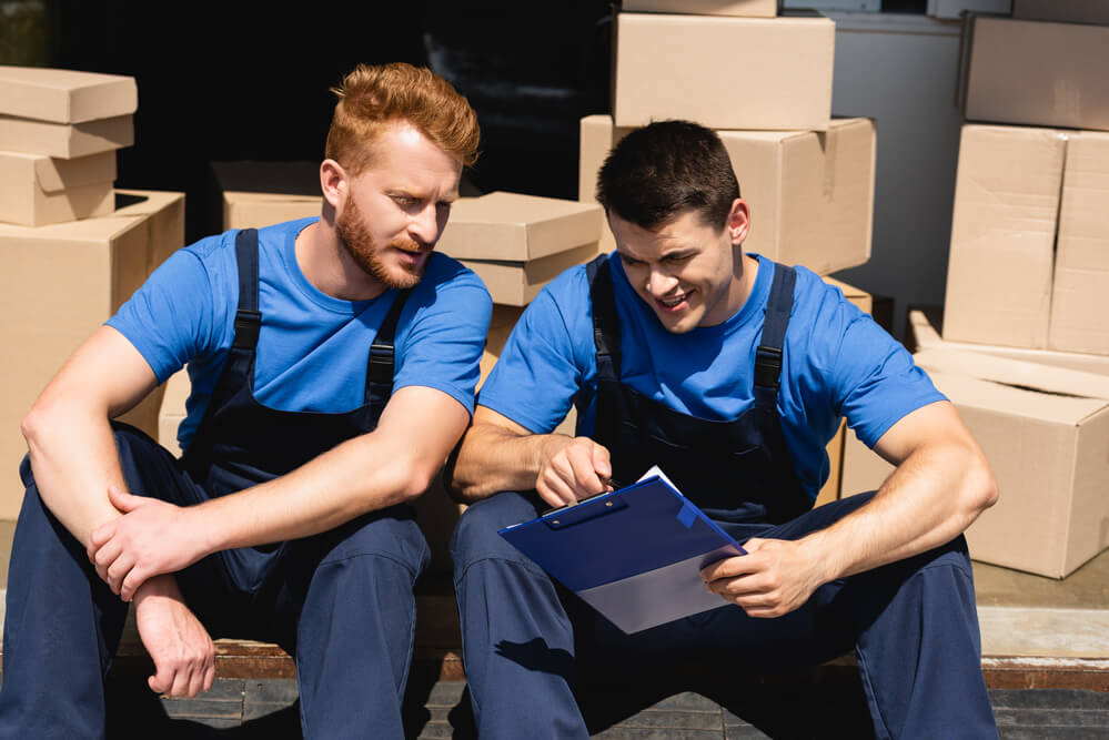 Moving Companies in Columbus checking their checklist.