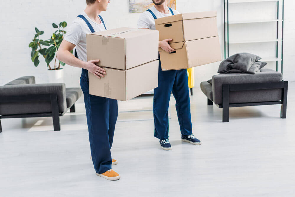 Nashville moving company employees lifting boxes.