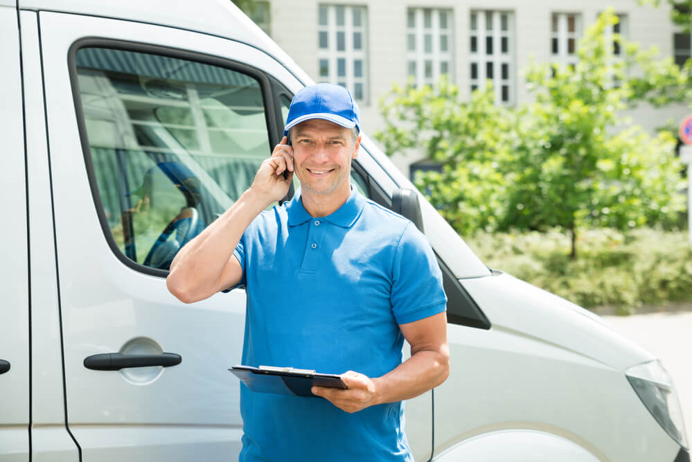 Moving companies in Auburn AL talking to a client on the phone