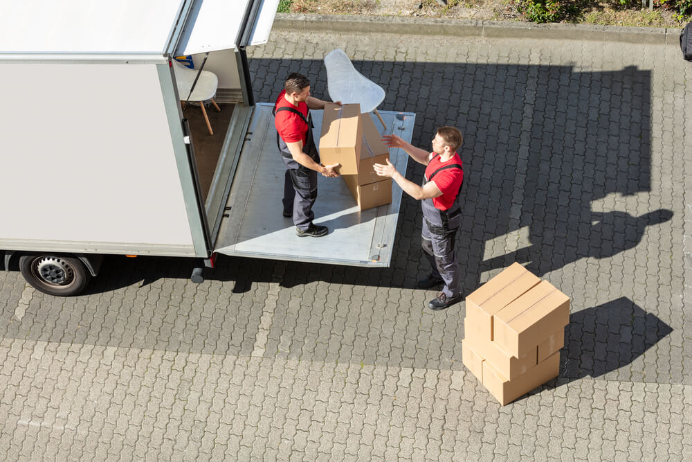 A moving van with movers in Montgomery AL