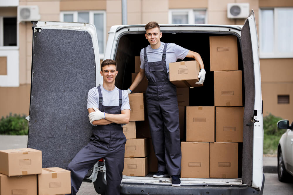 Moving Companies in Denver loading some boxes in a van