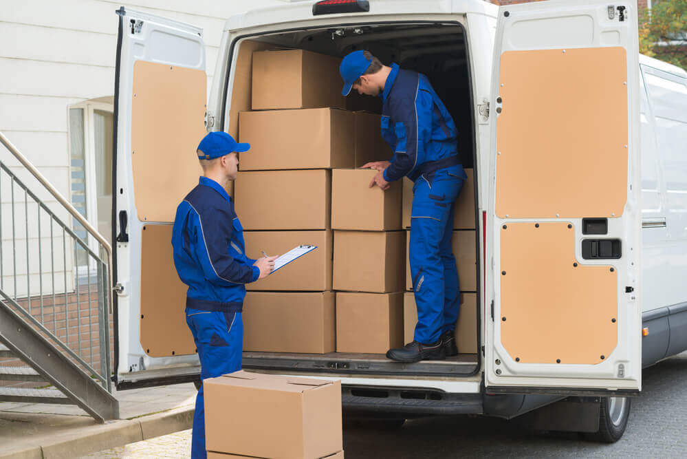 movers in Montgomery AL loading boxes.