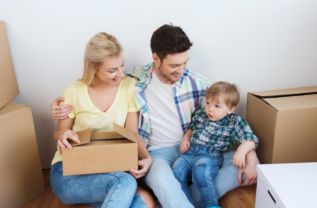 a family sitting while waiting for the everyday movers