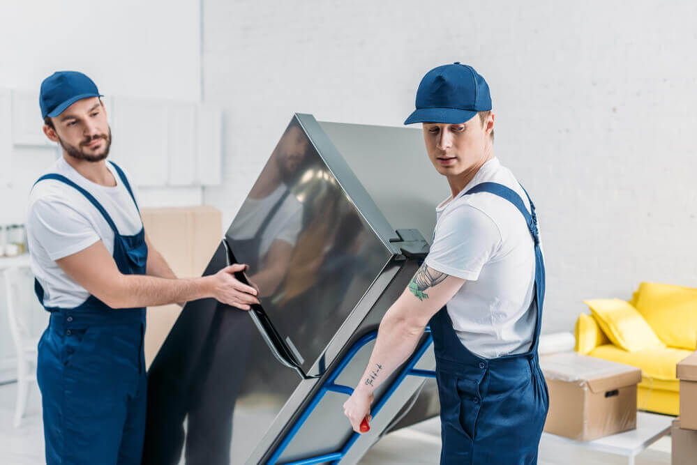 Moving company in Charlotte moving a fridge.