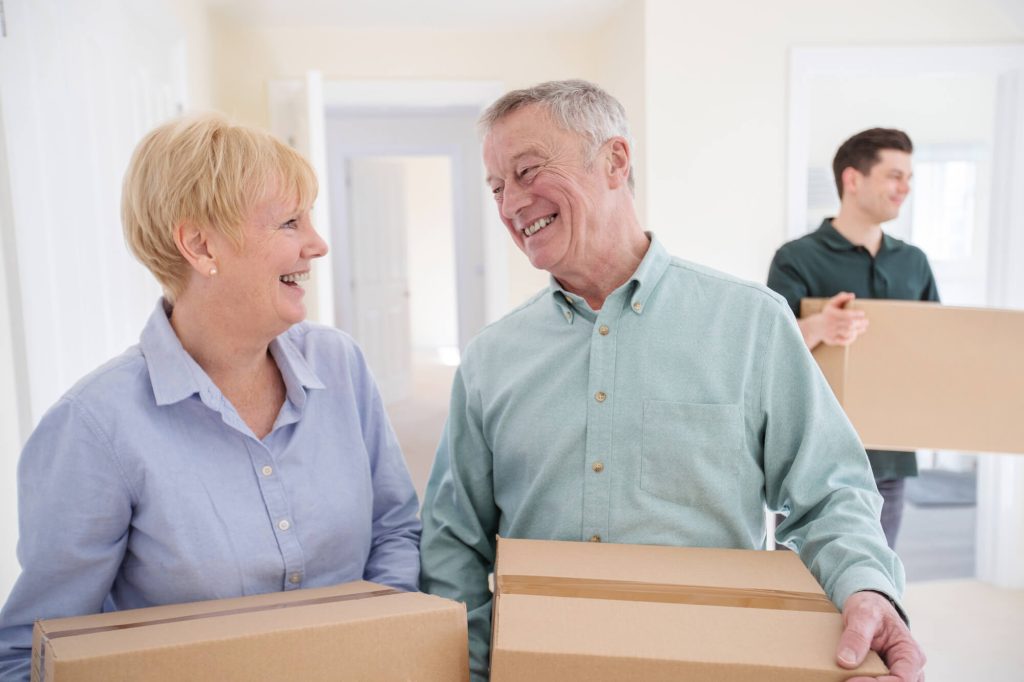 happy senior couple after hiring a moving company