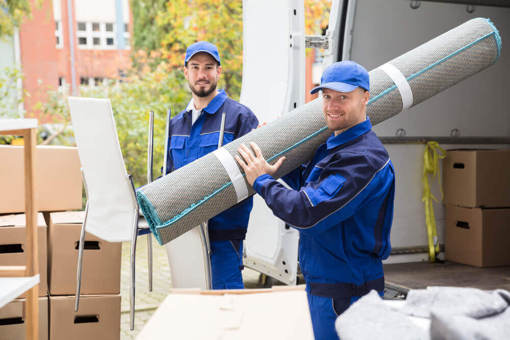 Loading a carpet with the best moving companies in Nashville