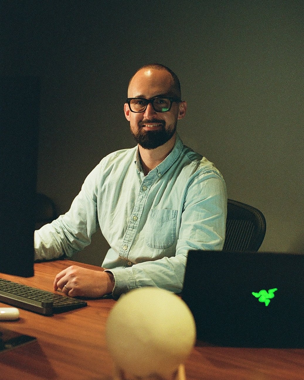 Ole Colon, video editor and AI artist, at his edit desk