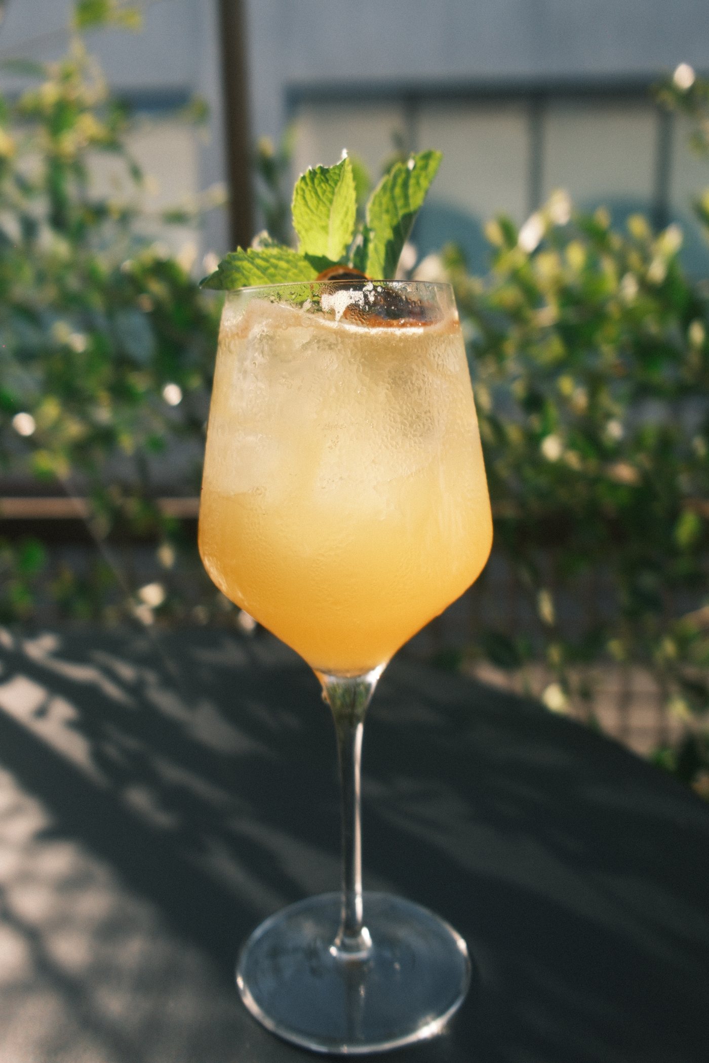 Golden spritz with fresh mint on the patio at aperitivo hour