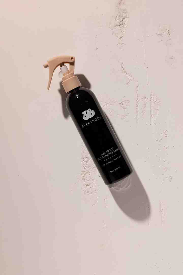 the 3VERYBODY Life Proof Tan bottle and the double-sided Tanning Mitt on a clean, modern background - Sweat-Resistant Self Tanner the 3VERYBODY Life Proof Tan bottle and the double-sided Tanning Mitt on a clean, modern background - Sweat-Resistant Self Tanner