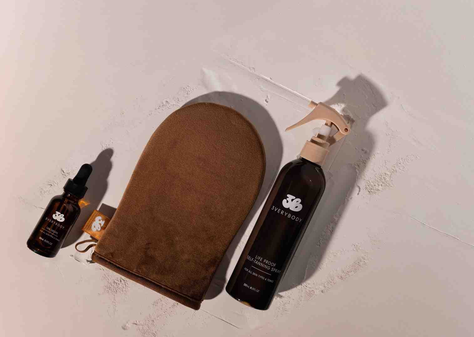 organized 3verybody kit next to individual products - best self tanner kit