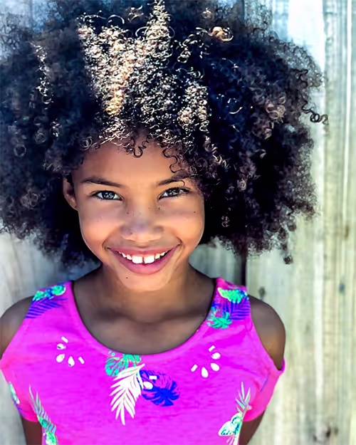 Girl with gapped teeth in Beverly Hills, a good candidate for Invisalign