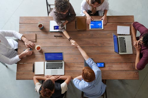 A group of people in a workspace. 