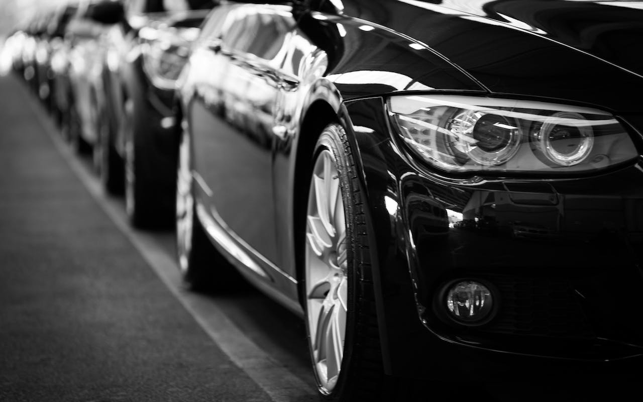 a beautiful black and white photo of a luxury vehicle 