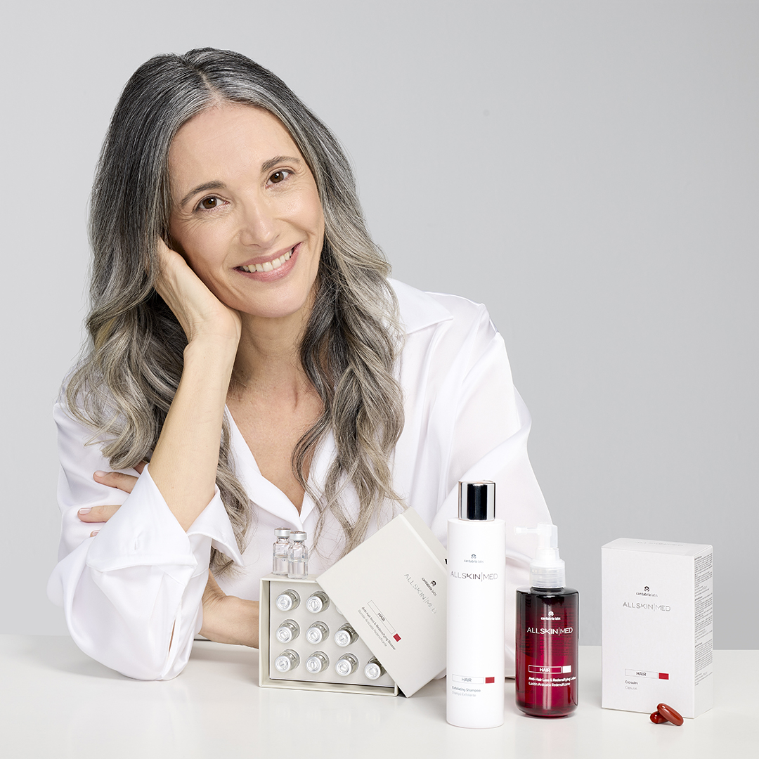 Two small brown glass bottles labeled AlumierMD Radiant 30 Exfoliating Facial Solution on a white surface with a white cloth and metal tool in the background.