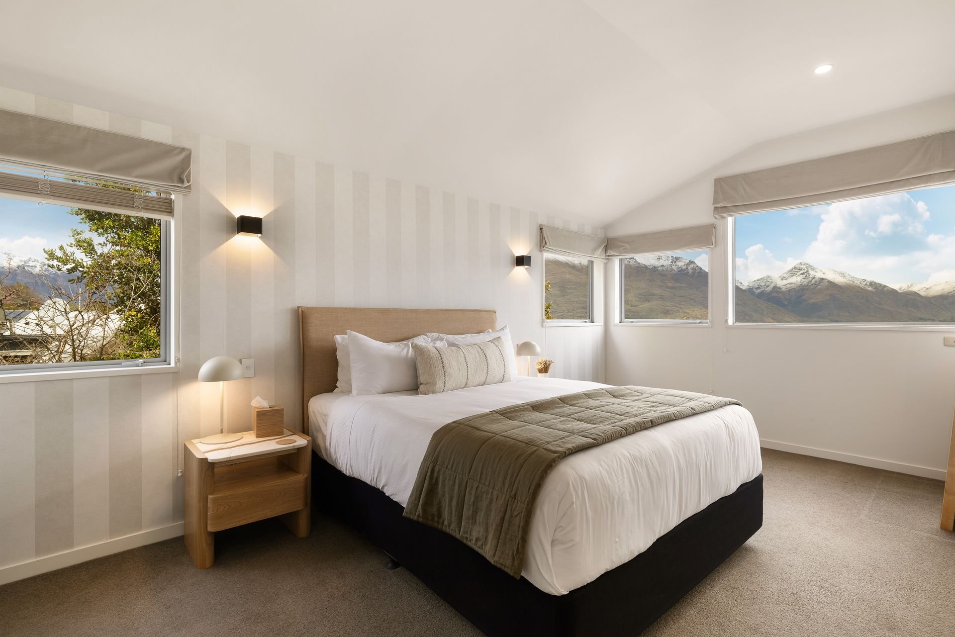 King bedroom with mountain views at Hillside Haven Queenstown