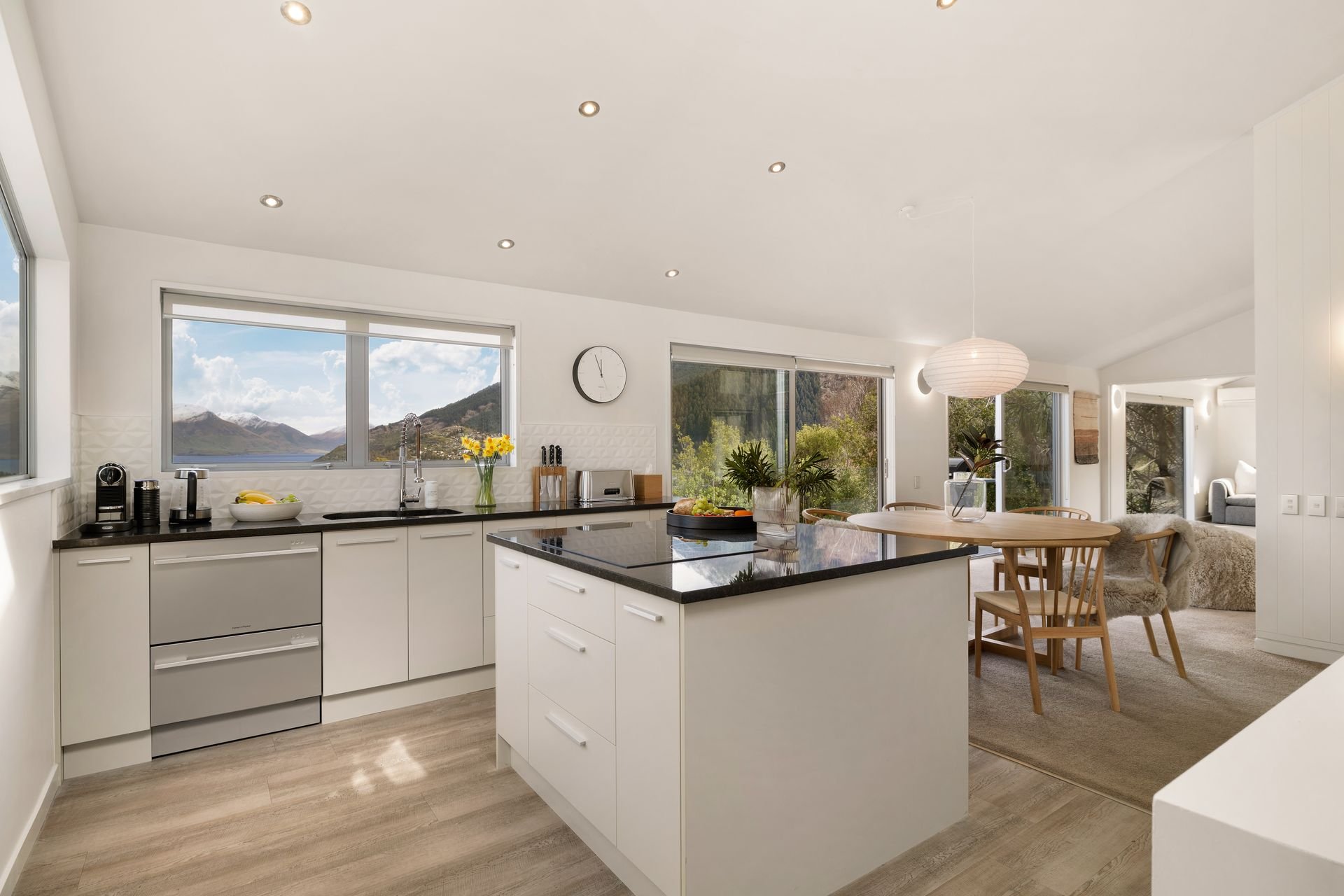 Kitchen with island and mountain views at Hillside Haven Queenstown
