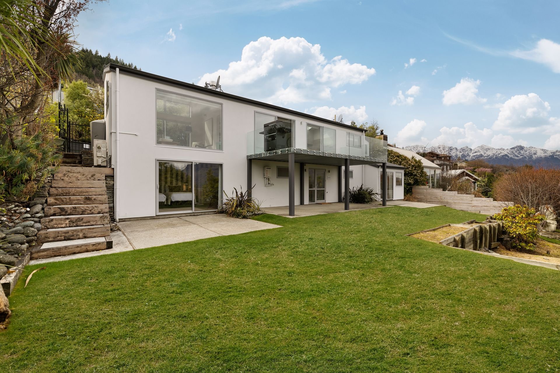 Exterior and lawn of Hillside Haven, a 3-bedroom Queenstown MTB holiday house