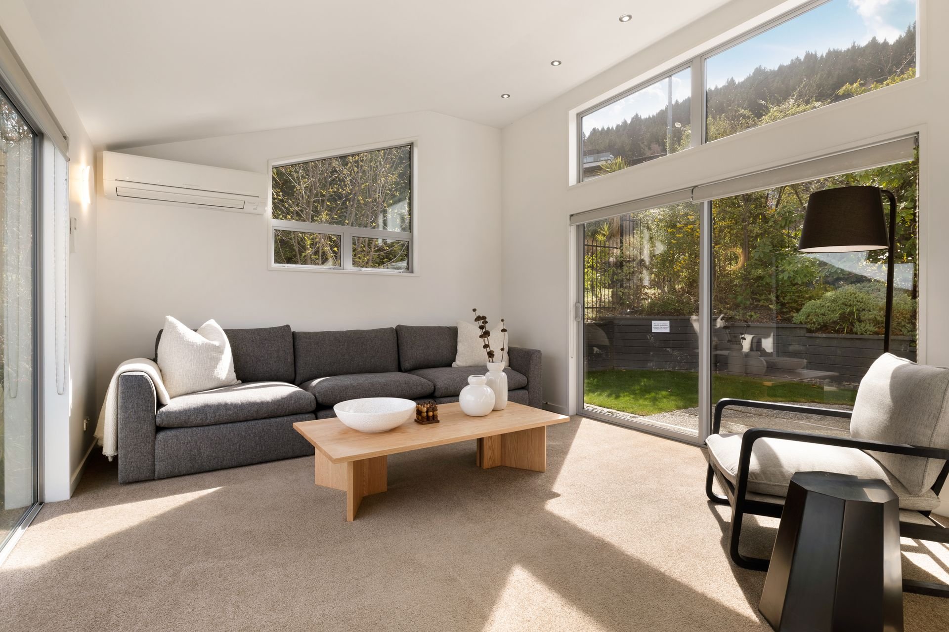 Second living room opening onto the garden at Hillside Haven Queenstown
