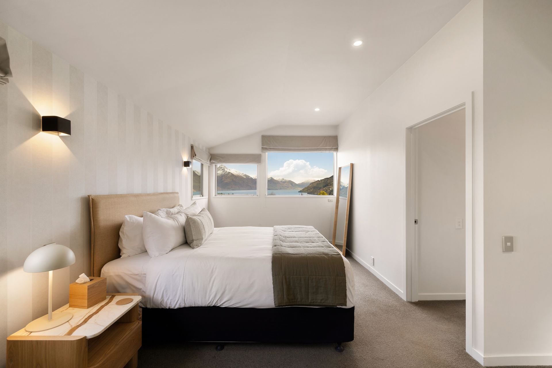 Bedroom with lake and mountain views at Hillside Haven Queenstown