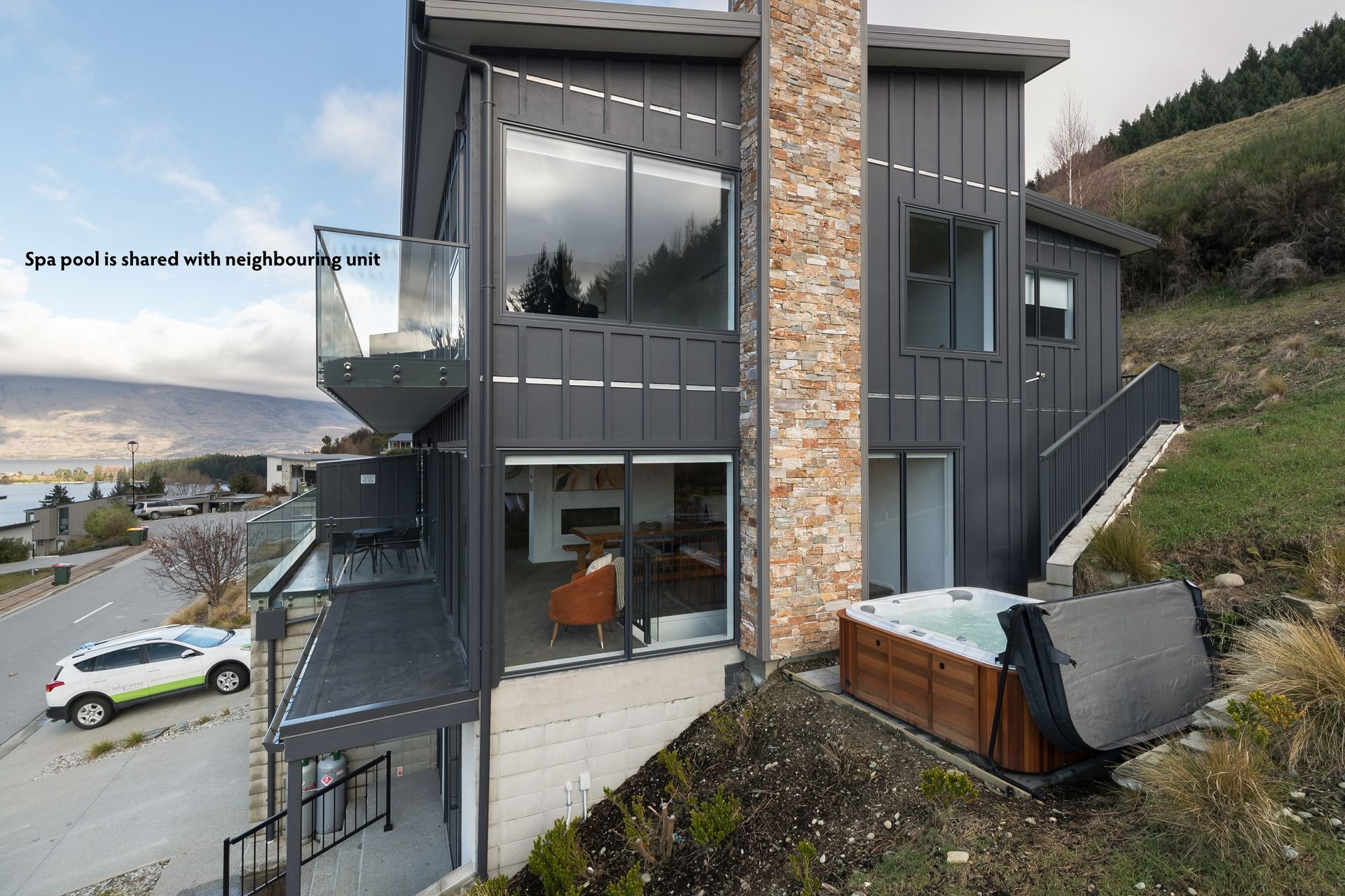 Side of the house with the spa pool at Cecil Peak House, Queenstown
