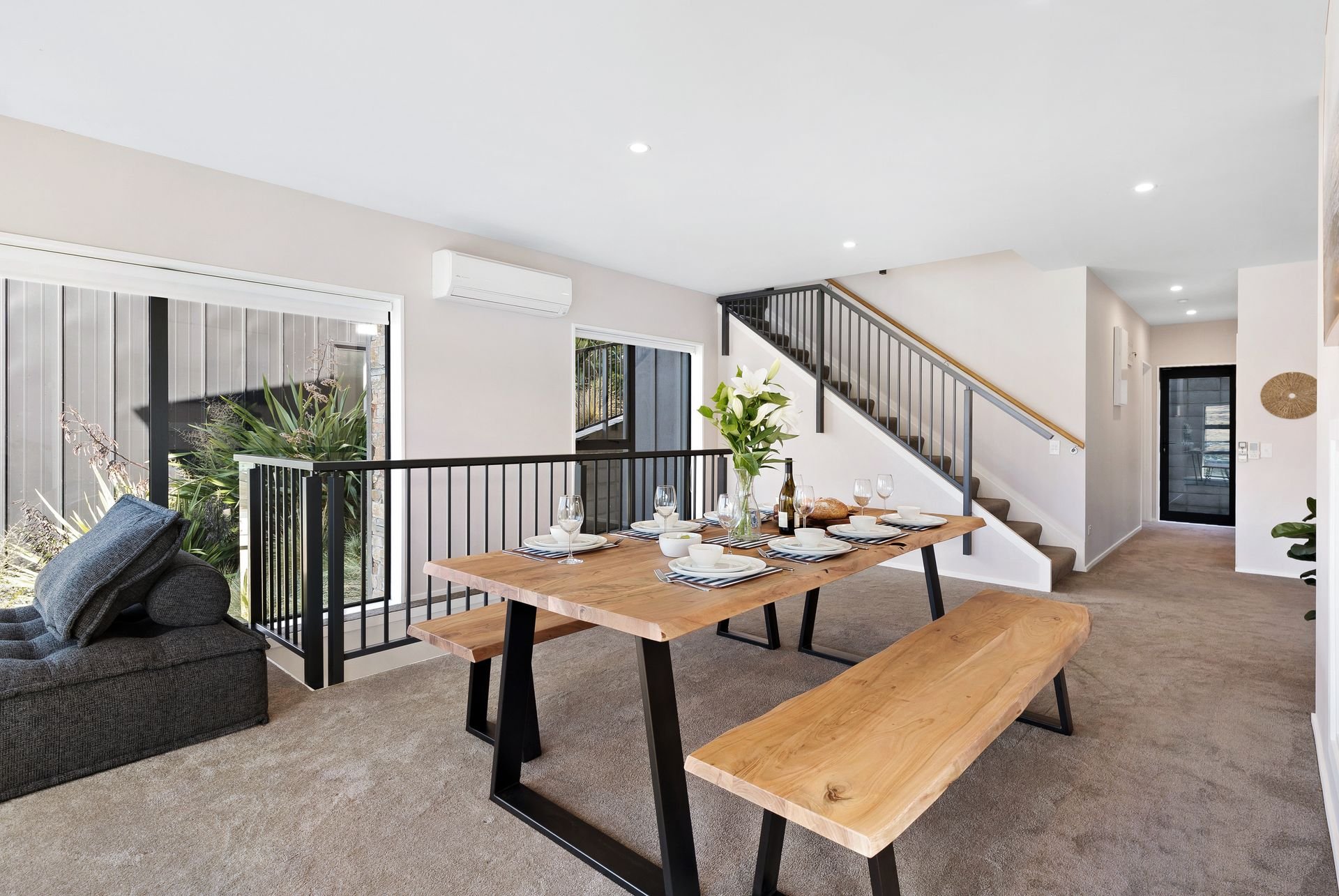 Dining area and staircase at Cecil Peak House, Queenstown