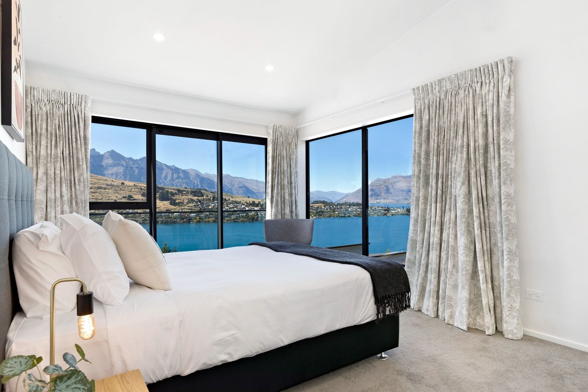 Bedroom with lake views at Cecil Peak House, Queenstown