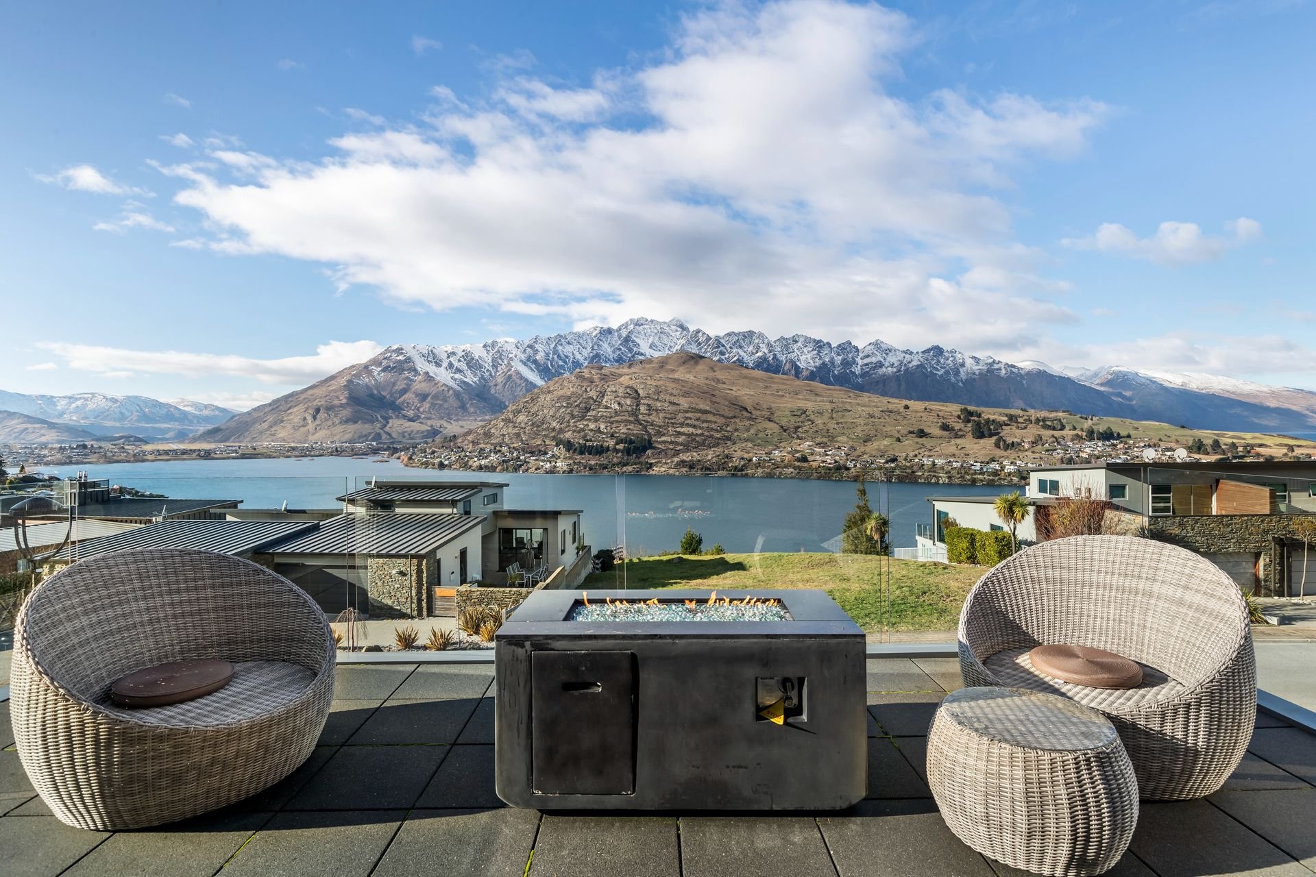 Front balcony with fire table and views over Lake Whakatipu at Highview Haven, Queenstown